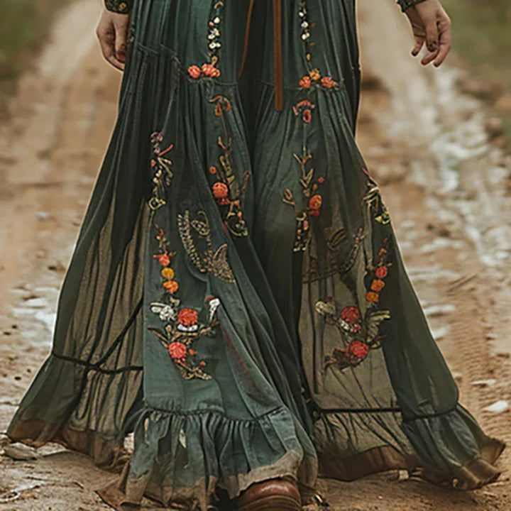 Romantic women's long sleeve maxi dress featuring elegant floral embroidery and a comfortable, relaxed fit.