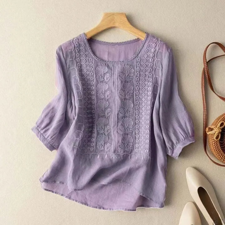 Versatile women's floral embroidered summer blouse with puff sleeves & a flowy high-low hem, great for any occasion.
