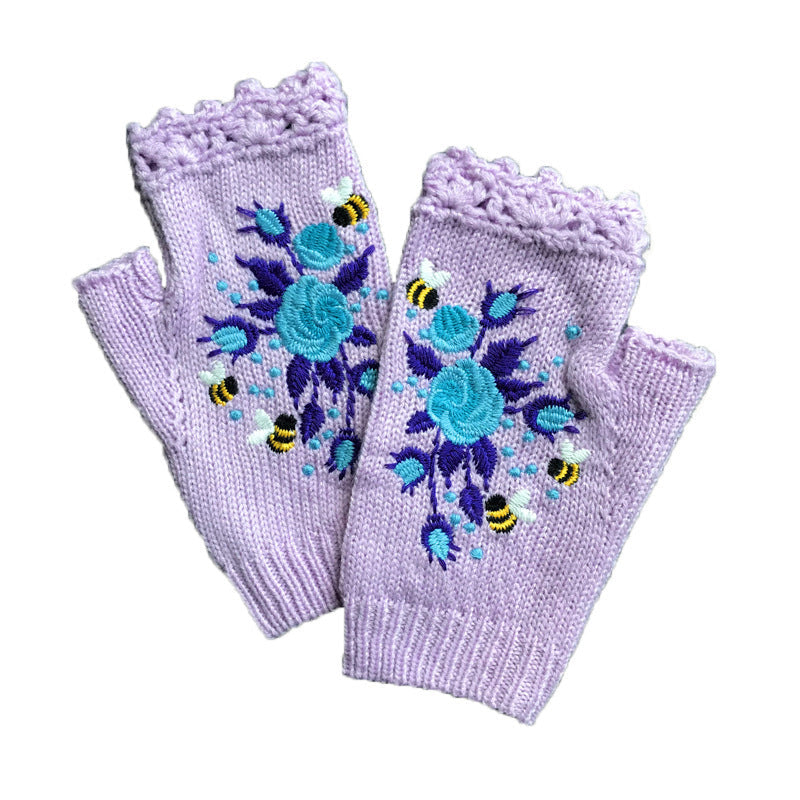 Close-up of the textured knit on women's embroidered winter gloves, showing the quality acrylic material.