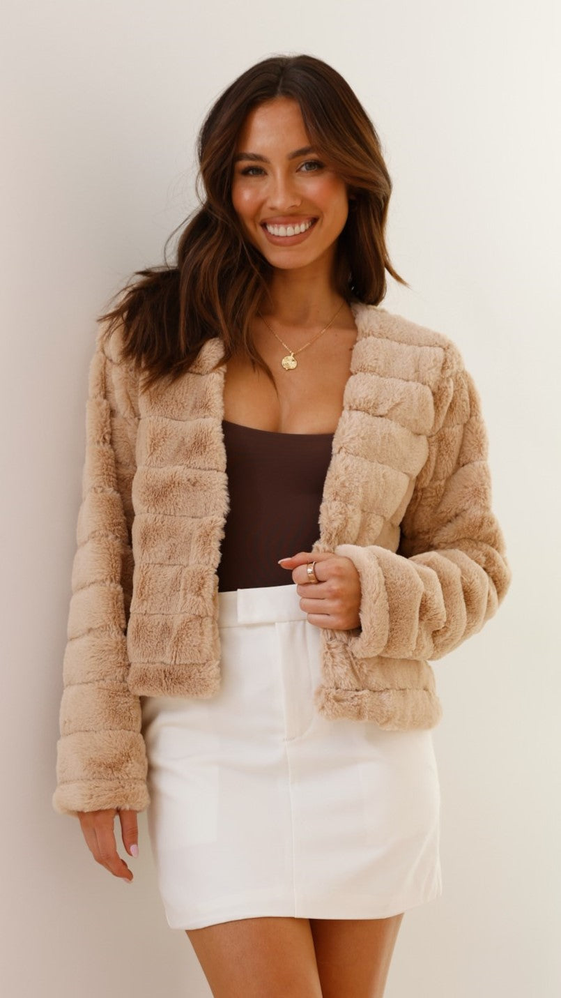 Full shot of a model wearing a women's chic faux fur cropped evening jacket.