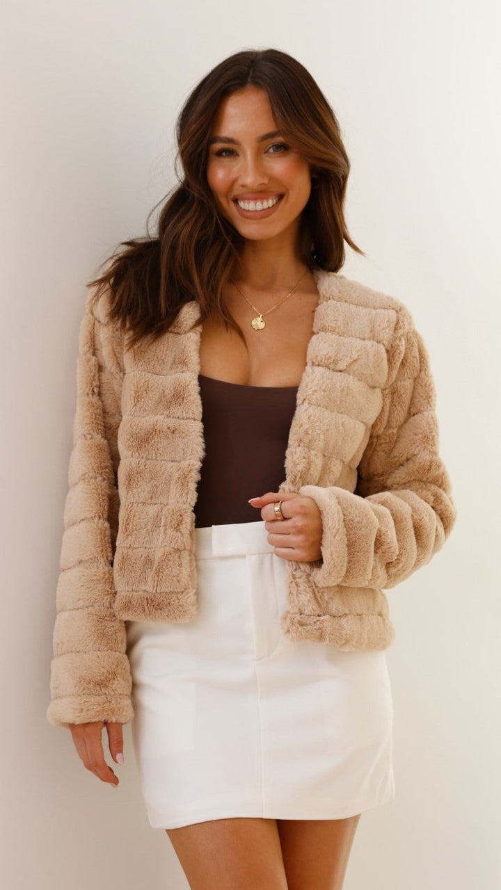 Full shot of a model wearing a women's chic faux fur cropped evening jacket.