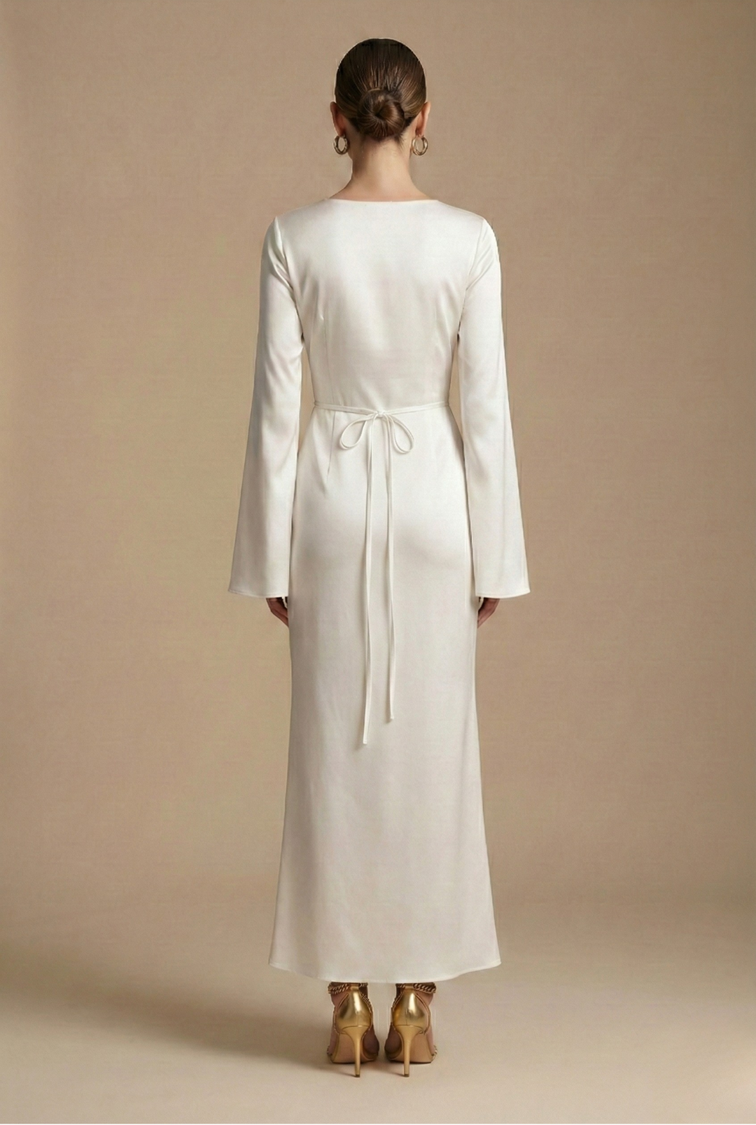Flowing women's maxi dress with elegant flare sleeves. Ideal long column gown for formal events.