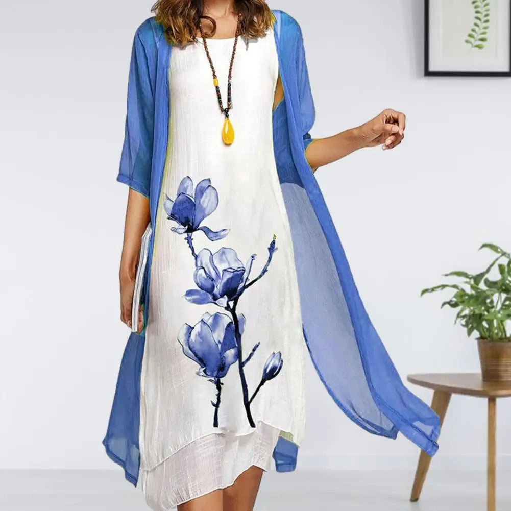 Versatile women's floral two-piece dress with sheer cardigan, creating an elegant spring/summer outfit.
