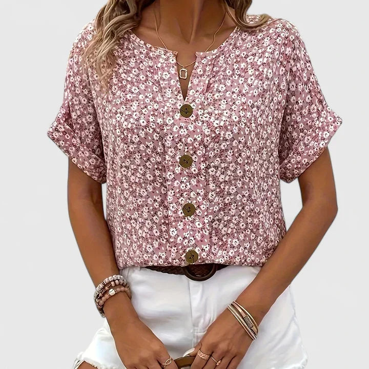 Versatile women's floral button-up blouse, ideal for comfortable casual spring and summer outfits. Stylish long sleeve top.