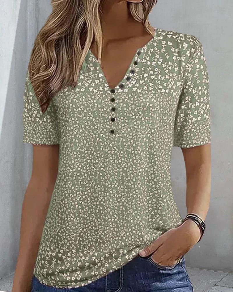 Chic women's floral button-up blouse, an elegant summer fashion top for vacation or everyday casual wear.