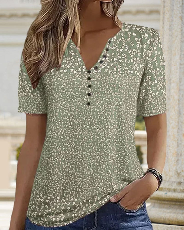 Vibrant floral print women's button-up shirt, an elegant and lightweight summer blouse for relaxed fit fashion.