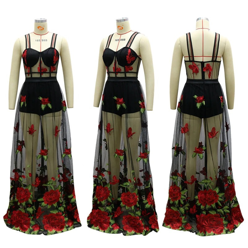 Woman wearing a flowing floral embroidered maxi dress with spaghetti straps, perfect elegant summer party attire.
