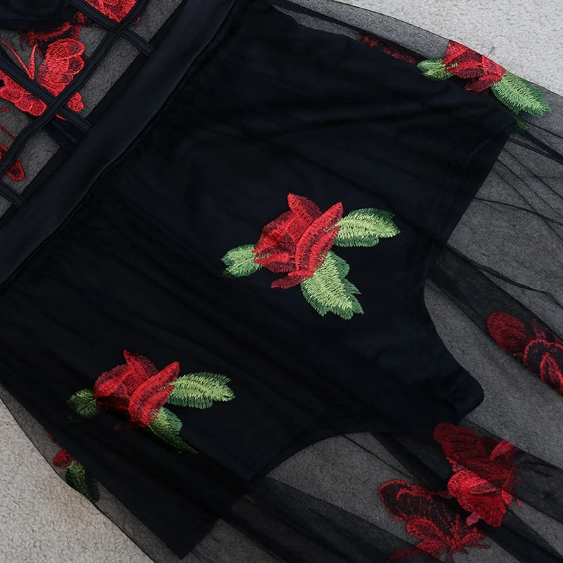 Back view of a romantic floral embroidery maxi dress with spaghetti straps, highlighting its elegant, flowing design.