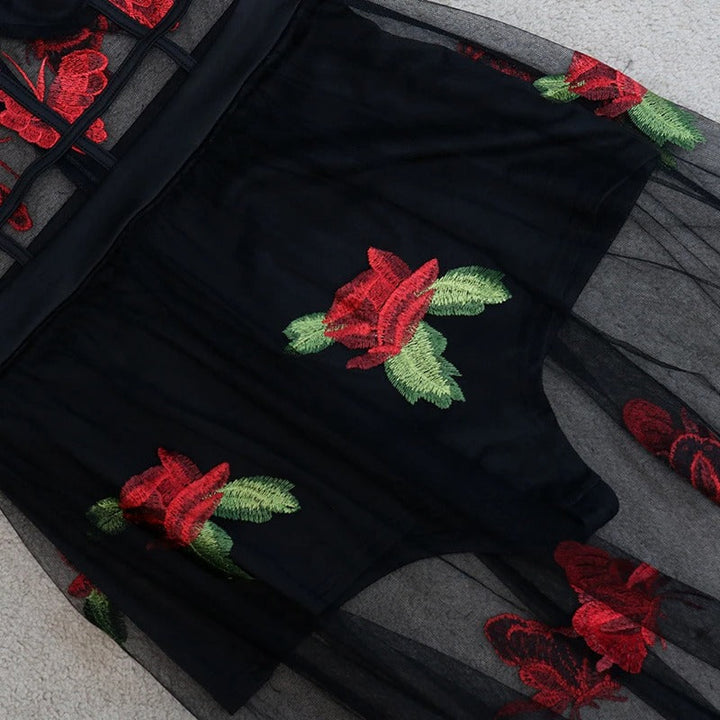 Back view of a romantic floral embroidery maxi dress with spaghetti straps, highlighting its elegant, flowing design.