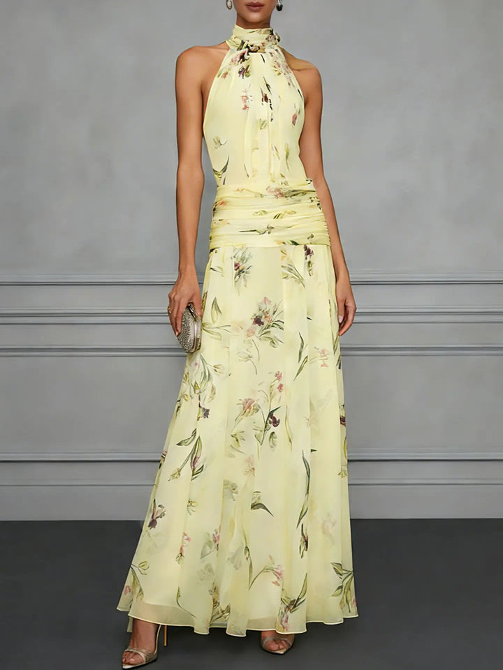 Flowy floral halter maxi dress with adjustable waist for women. Elegant sleeveless design, ideal for events.