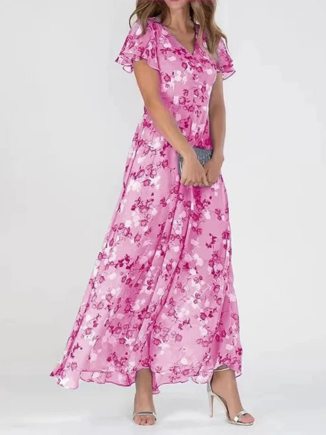 Beautiful floral rosette maxi dress for women, with delicate flutter sleeves. Great for beach, party or wedding guest attire.