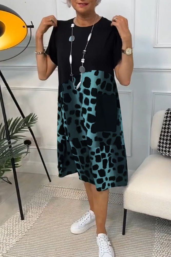 Women's elegant floral midi dress, a sophisticated choice for spring fashion with a defined waist.
