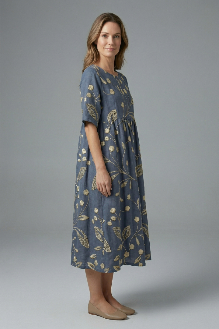 Flattering women's floral midi dress with a round neck, short sleeves, & elegant flared skirt style.