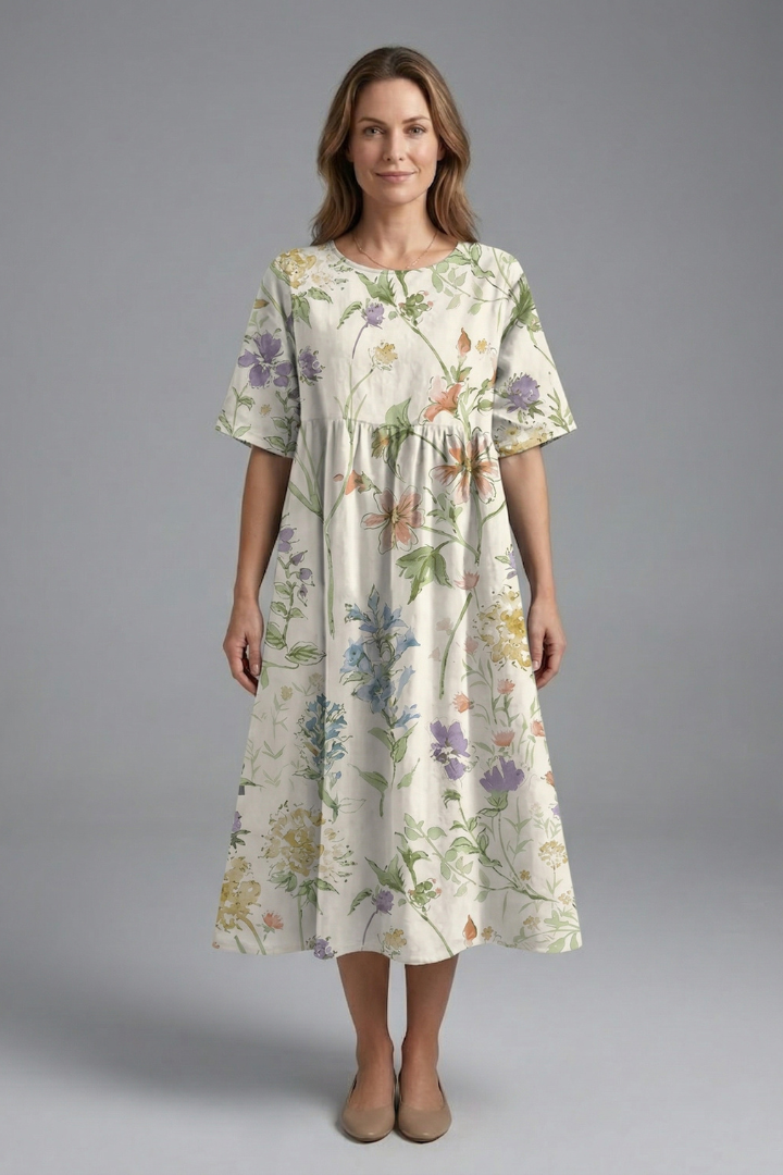 Stylish women's floral midi dress, round neck, short sleeves, flared skirt; ideal for everyday wear.
