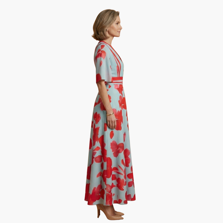 Vibrant floral pattern on a flowing V-neck maxi dress for women. Chic summer event attire.