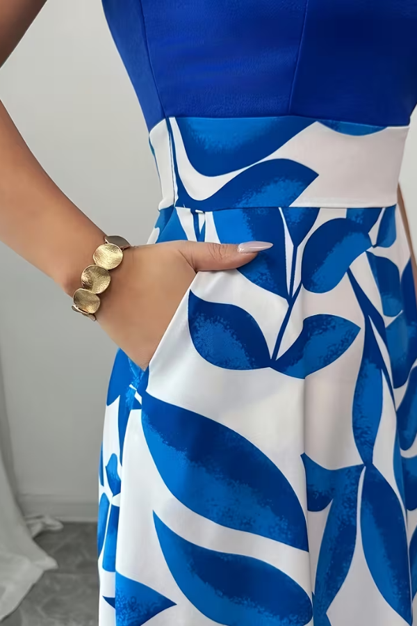 Comfortable women's floral V-neck A-line maxi dress, featuring useful pockets for a chic summer look.