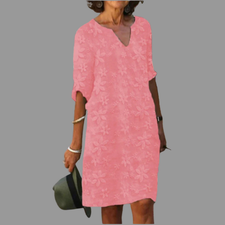 Comfortable women's summer midi dress, featuring a vibrant floral print and elegant V-neck design. Occasion wear ready.