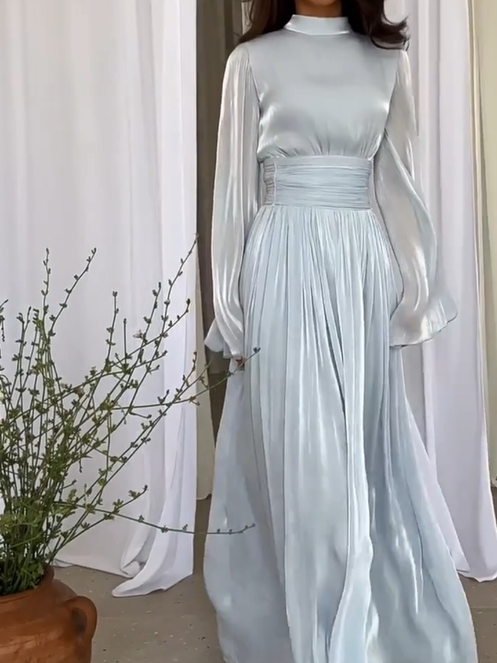 Long, comfortable women's flowing maxi dress featuring an elegant and playful design, great for summer styles.