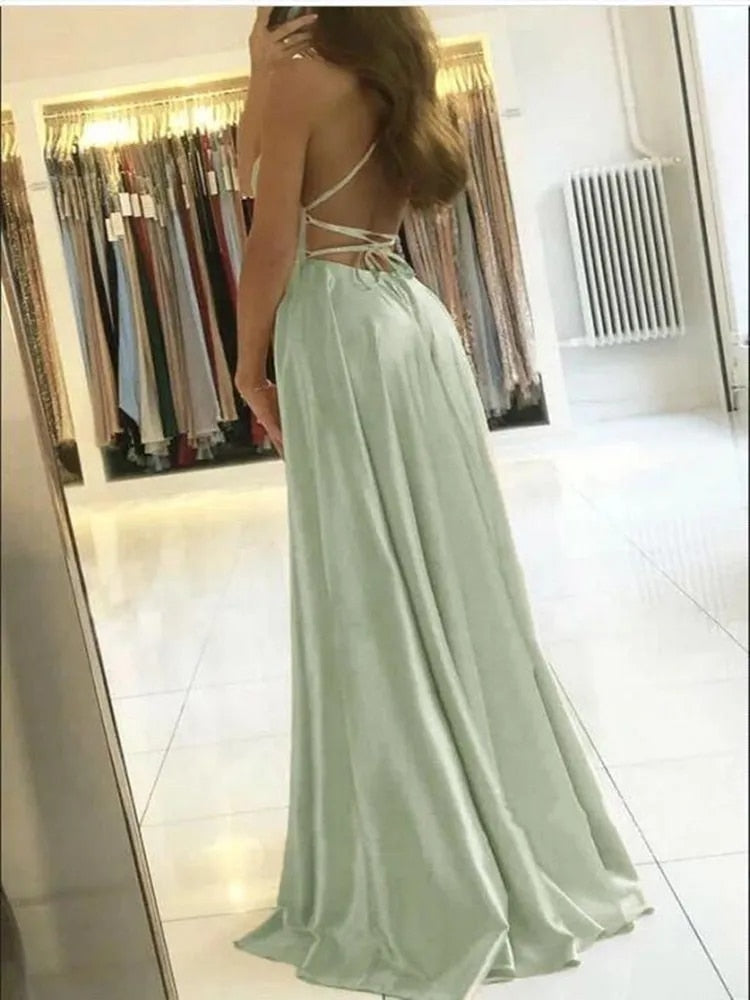 Elegant women's flowing maxi dress with a stylish side slit, perfect for versatile summer or evening wear.