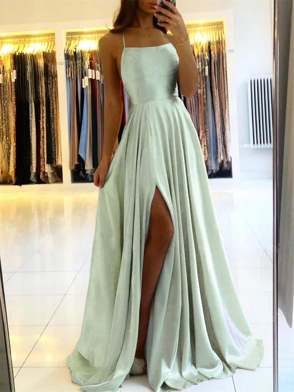 The Sophie flowing maxi dress for women, featuring a sophisticated side slit. Suitable for evening events.