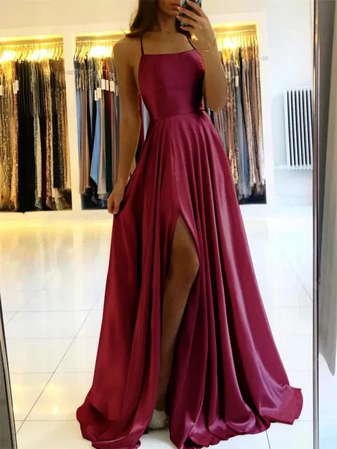 Full-length women's flowing maxi dress, showcasing its elegant side slit and comfortable design for summer.