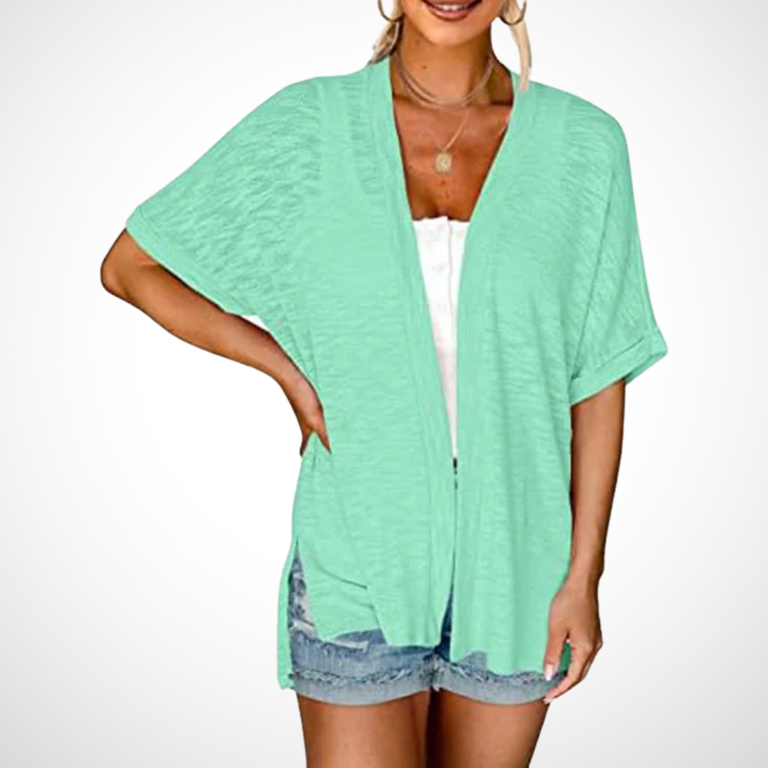 Elegant white women's short sleeve flowing cardigan, an open front lightweight summer top ideal for versatile fashion.