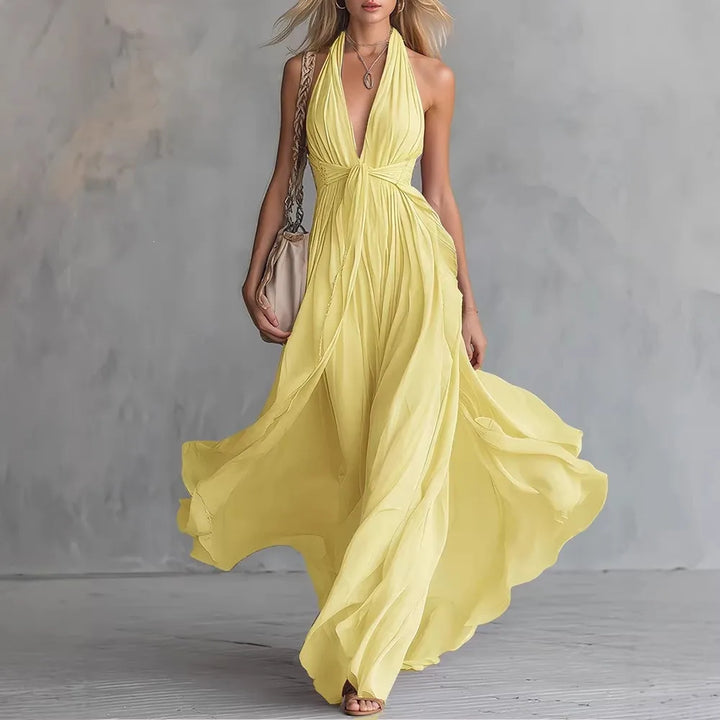Dramatic elegant flowy halter maxi dress for women, perfect as formal evening or party wear.