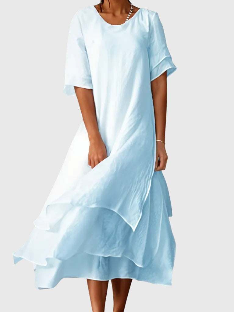 Modern women's elegant midi dress. Soft, flowy fabric ensures comfortable wear & a flattering silhouette. Summer essential.