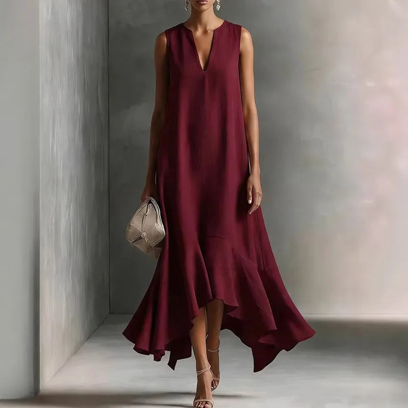 Beautiful women's elegant V-neck sundress, flowy fabric, and a pretty ruffle hem. Perfect sleeveless summer dress.
