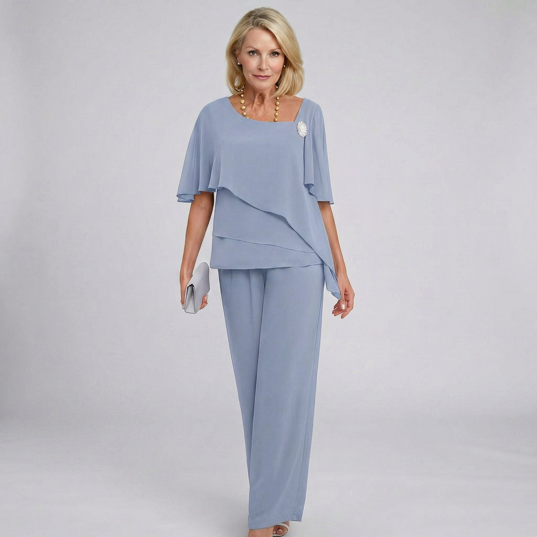 Elegant women's flutter sleeve wide-leg pant set, perfect formal attire for wedding guests & special occasions. Two-piece draped.