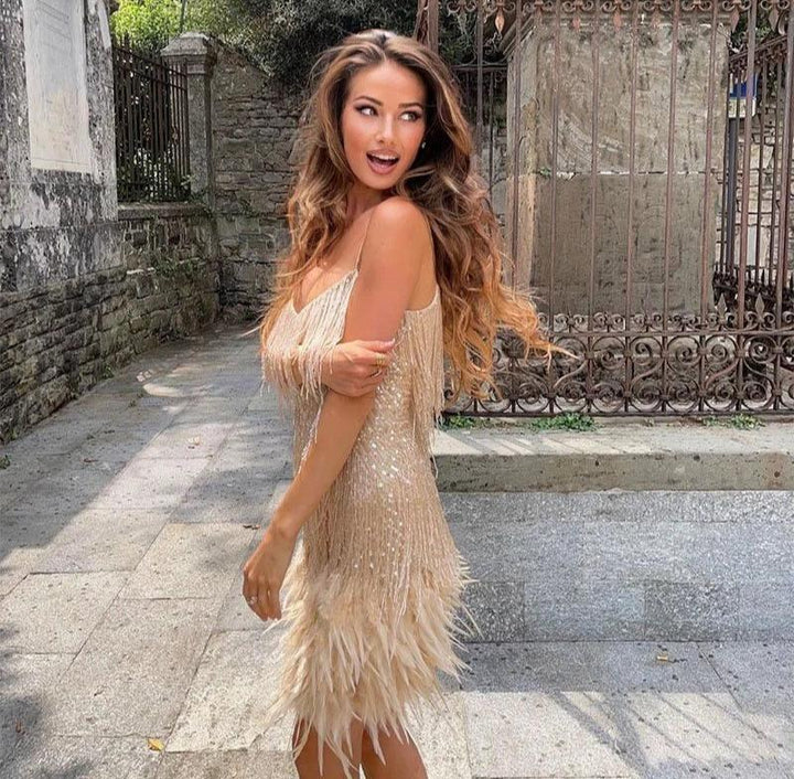 Full-length view of the women's formal fringe feather dress with movement and flow.