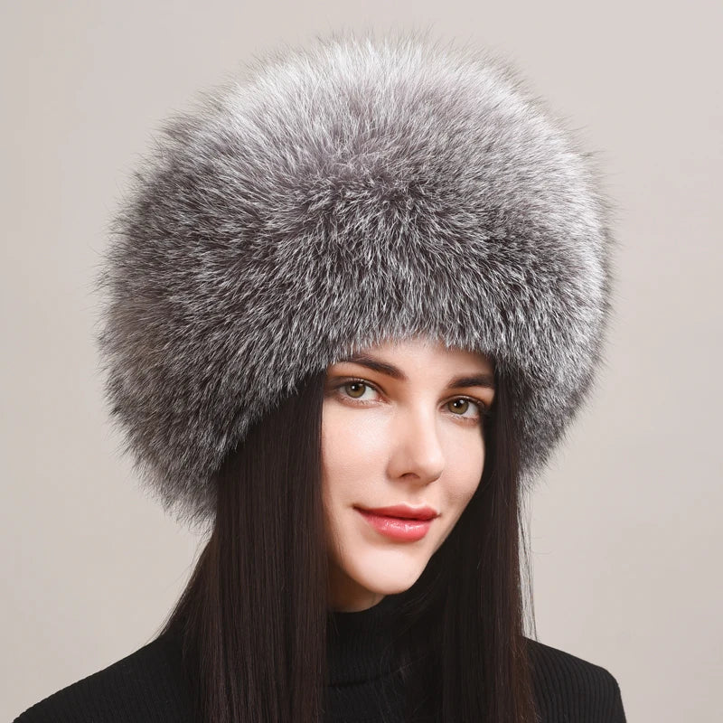 Close-up texture of genuine fox fur on a women's winter hat, highlighting its natural beauty and warmth