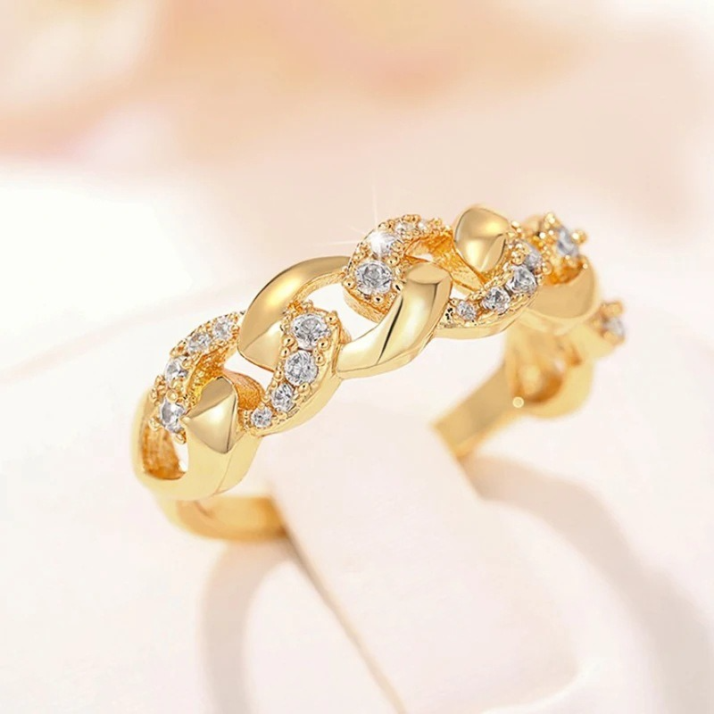 Elegant women's gold chain ring, versatile for everyday wear or formal occasions. Stackable fashion jewelry accessory.