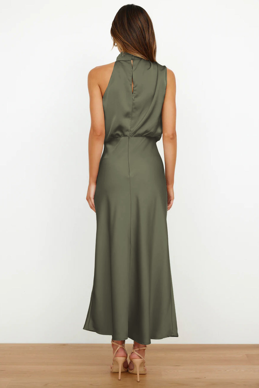 Front view of an elegant women's halter evening gown, floor-length & flowing, perfect for formal events.
