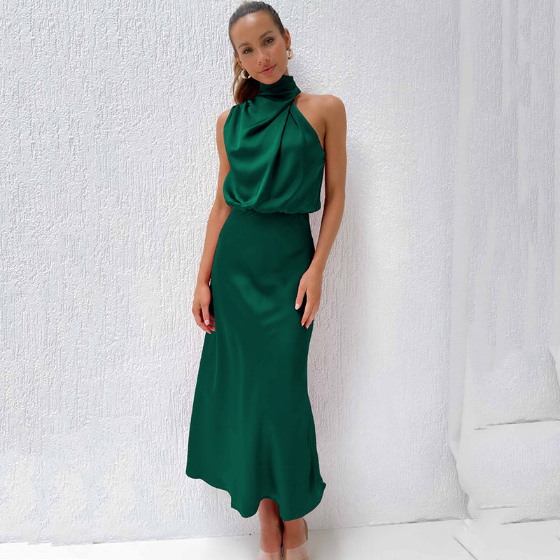 Close-up of the elegant halter neckline on a women's floor-length evening gown for special events.
