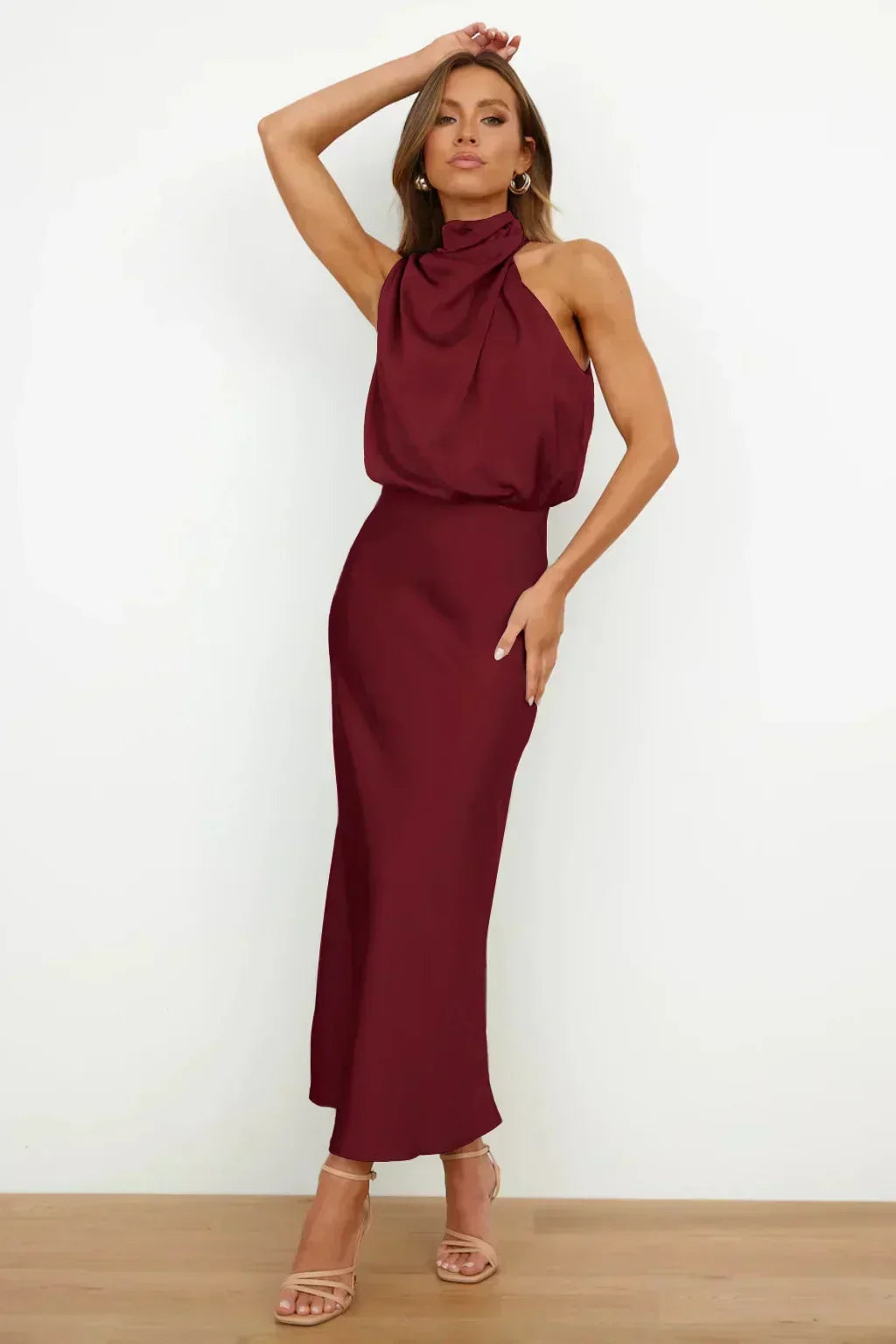 Versatile women's long halter dress, suitable as evening gown, prom, or bridesmaid dress, open back.