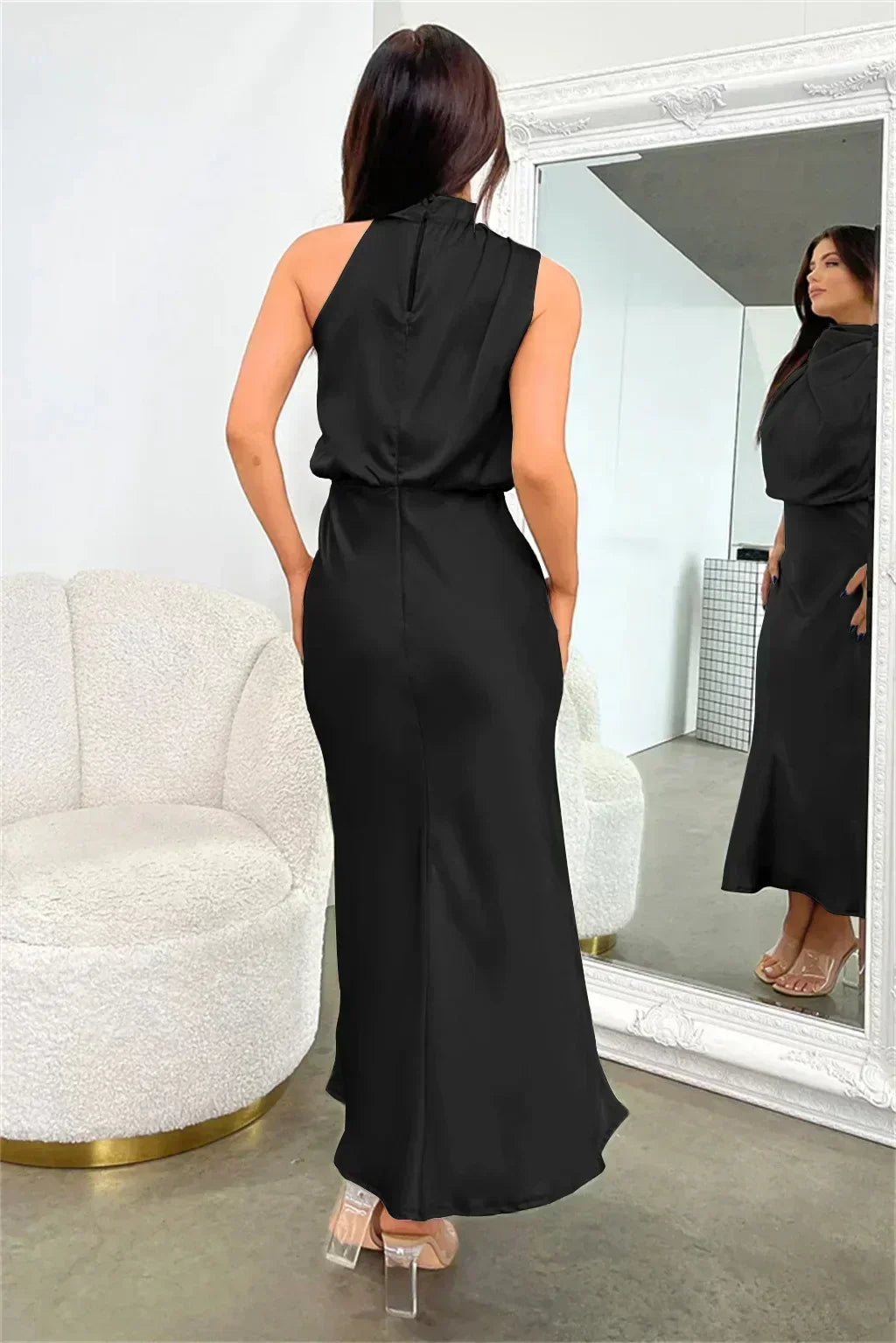 Simple yet elegant women's halter evening gown, floor-length with an open back, for refined special events.