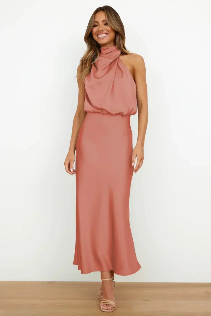 Luxurious women's gala dress, halter style, floor-length evening gown with an elegant open back.