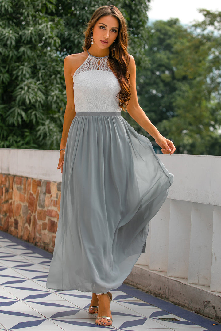 Elegant women's halter neck maxi dress in navy blue, perfect for wedding guests & formal events