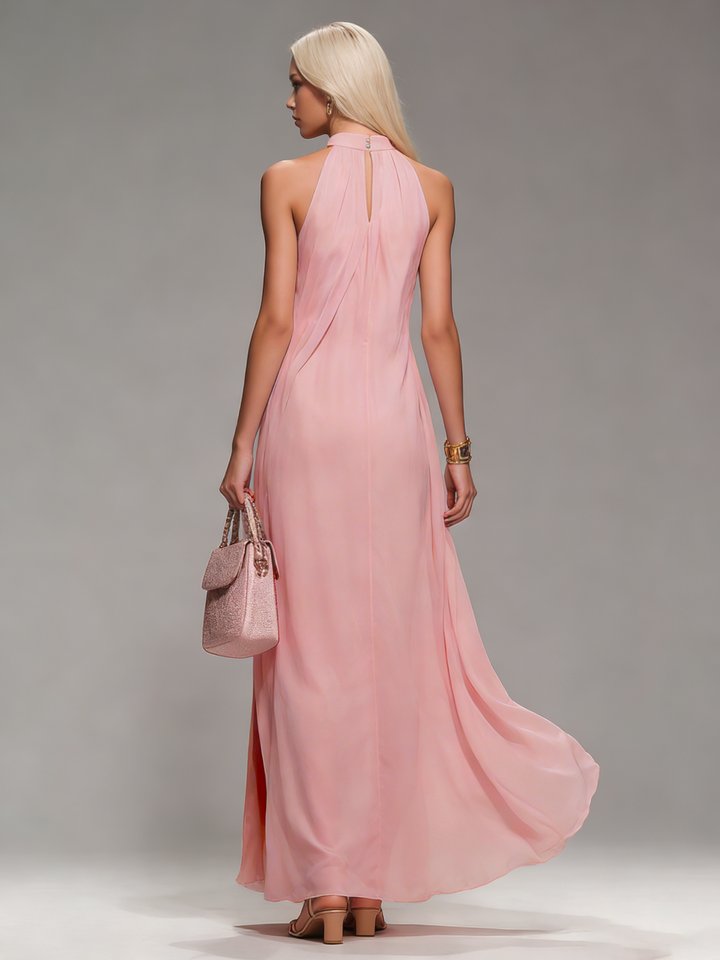 Comfortable women's flowy halter neck maxi dress with slit, ideal for summer fashion & vacation.