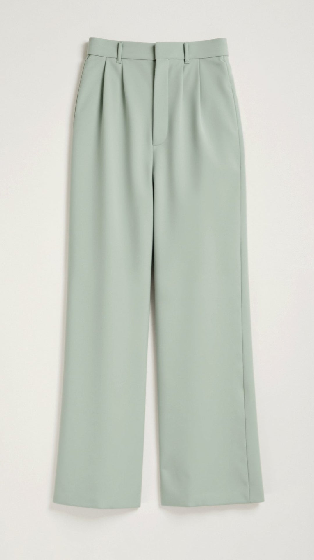 Woman walking in high-waist wide-leg spring pants, demonstrating their comfortable movement and elegance.