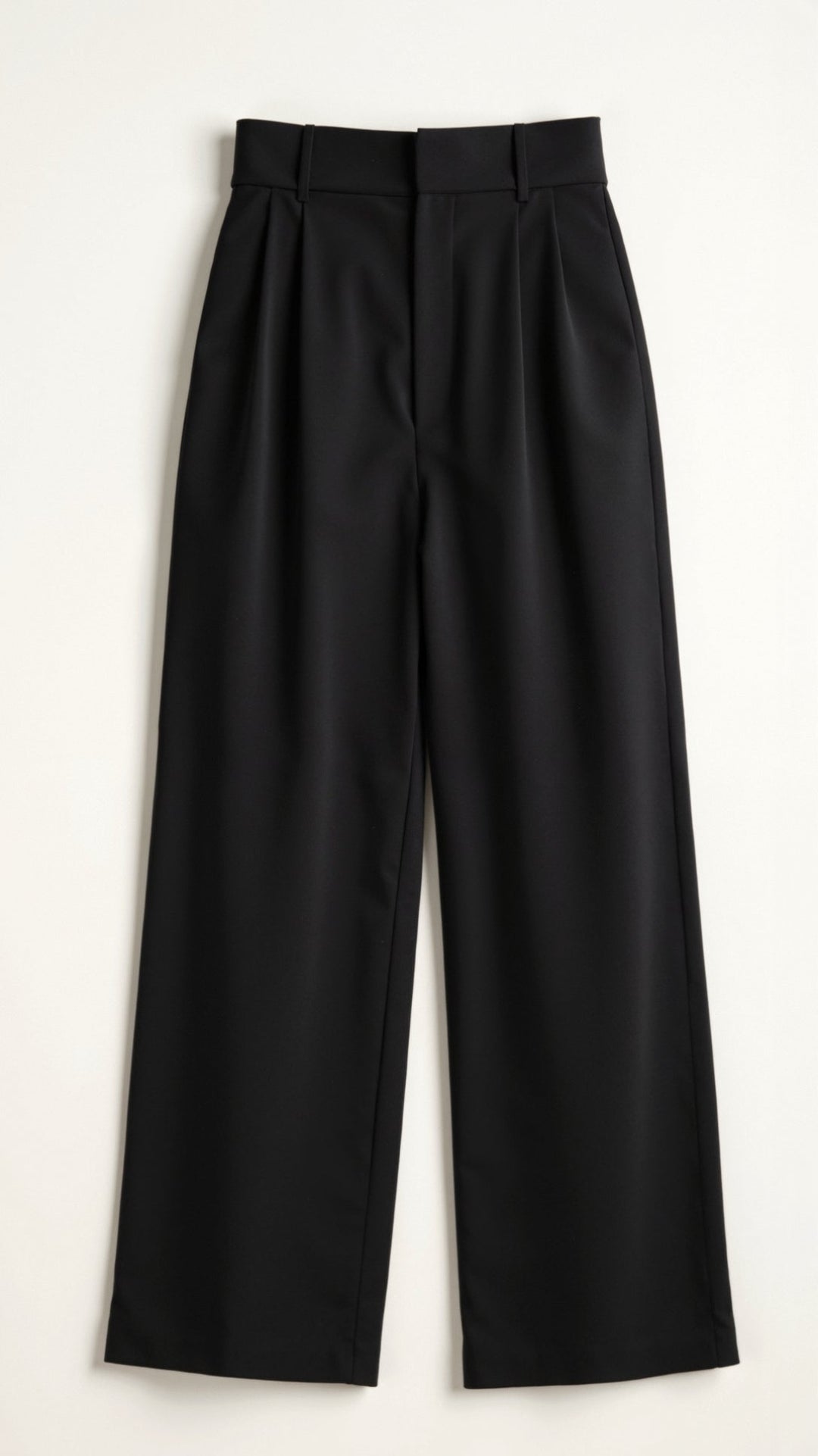 Detail of the waistband on high-waist wide-leg spring pants, suitable for a polished office look.