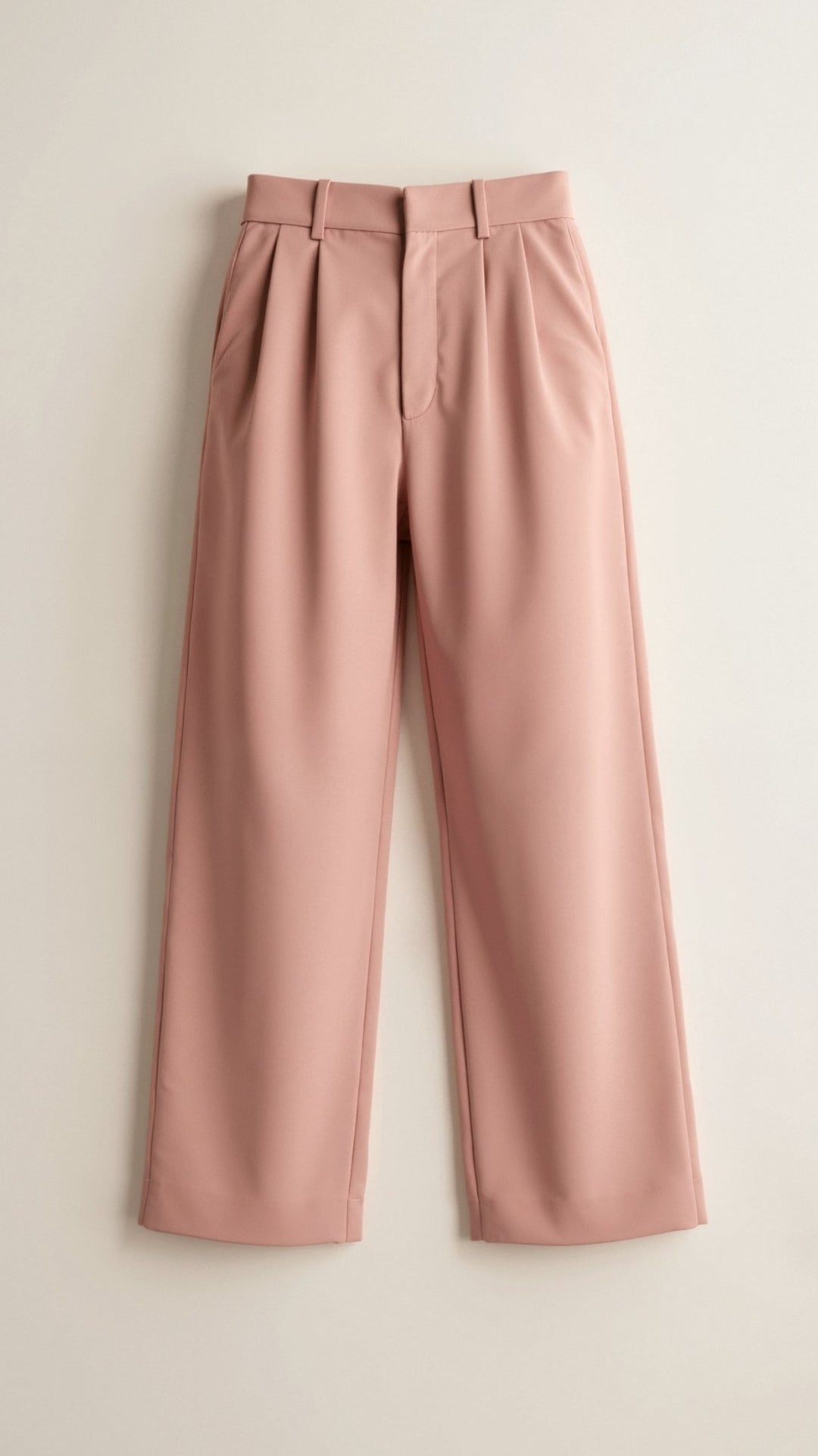 Pair of women's high-waist wide-leg pants draped on a hanger, showcasing their flowing design.
