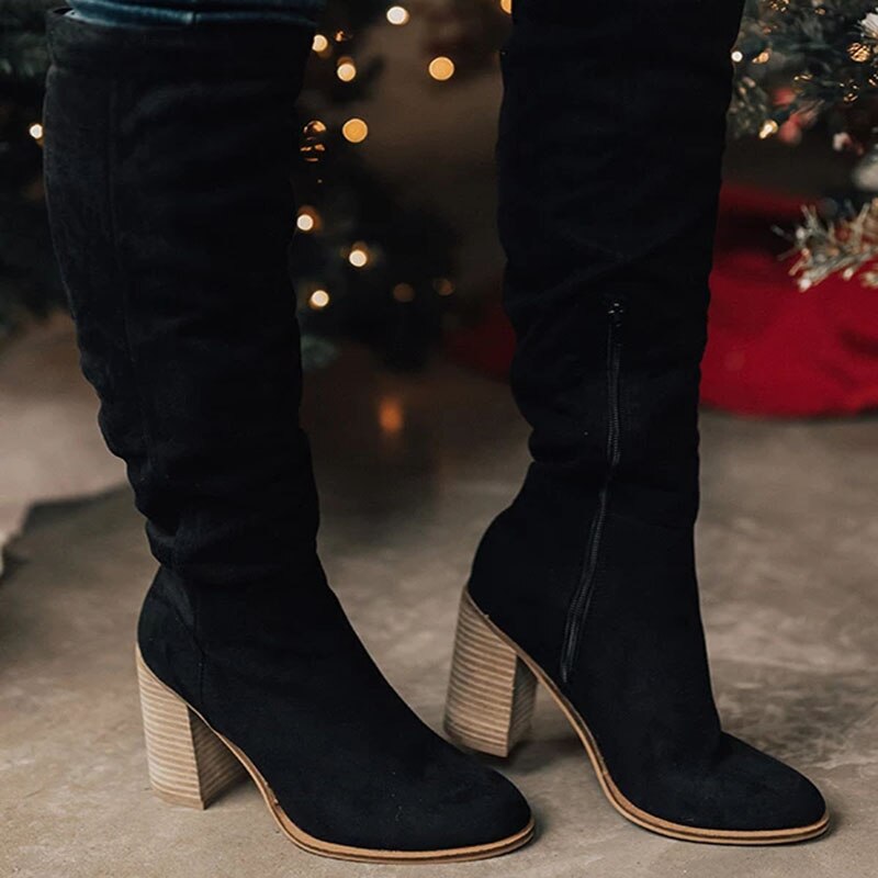 Fashionable women's knee-high boots offering chic style & comfort. Ideal tall boots for elegant fall outfits.