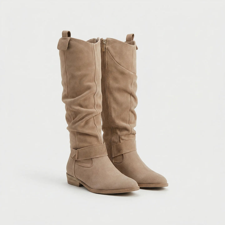 Chic women's knee-high boots, showcasing the smooth material, comfortable low heel, and full side zipper.