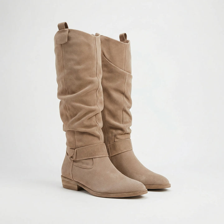 Versatile women's knee-high boots with an elegant silhouette, ideal for casual outfits or chic fall/winter fashion.