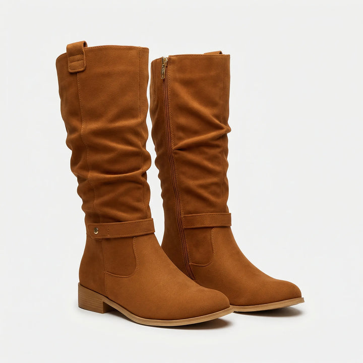 Sleek women's knee-high boots, offering effortless style with a durable finish and an elegant, timeless design.