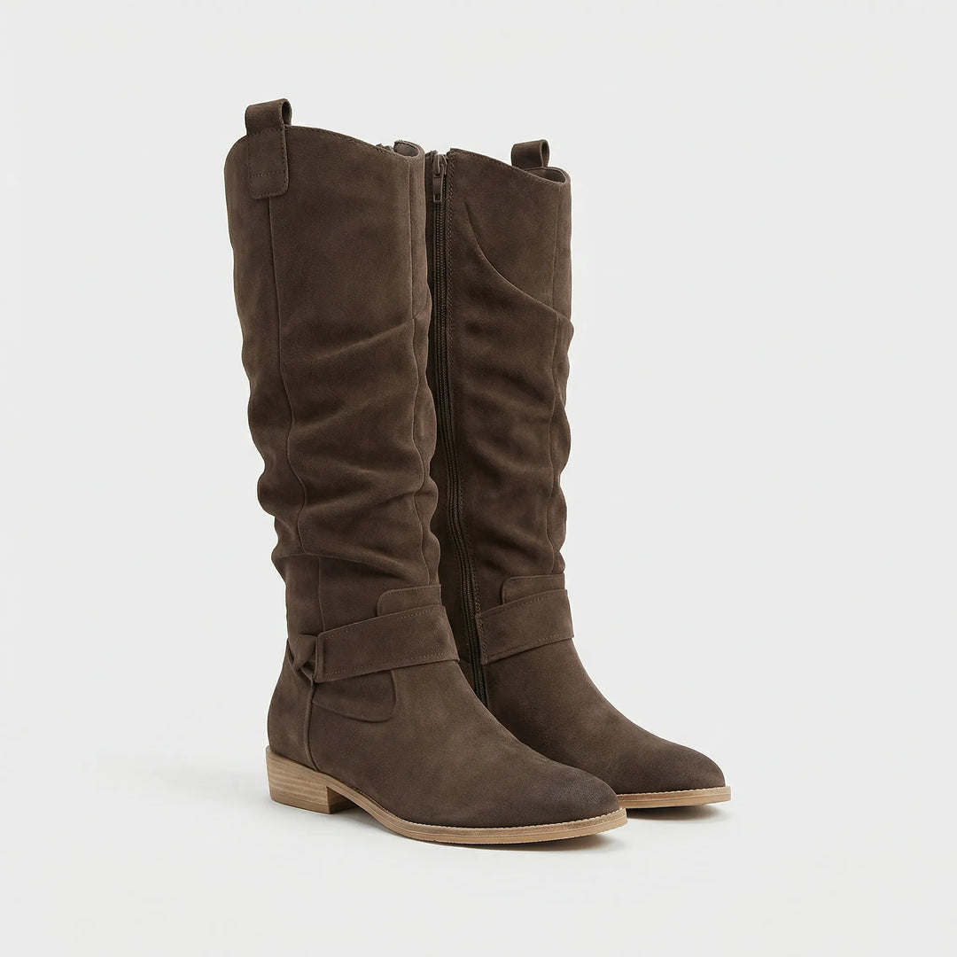 Fashionable women's knee-high boots, a chic and warm footwear choice for elegant fall and winter ensembles.