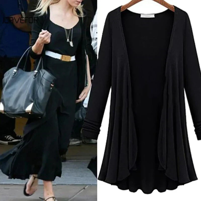 Soft knit women's cardigan featuring elegant ruffles and an open front, offering cozy comfort and style.