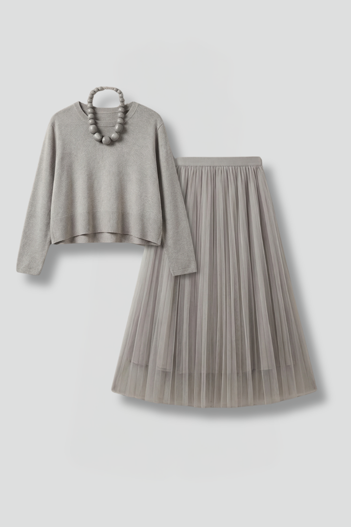 Elegant women's layered dress with pleated midi skirt. Perfect for formal events, parties, or stylish casual wear.